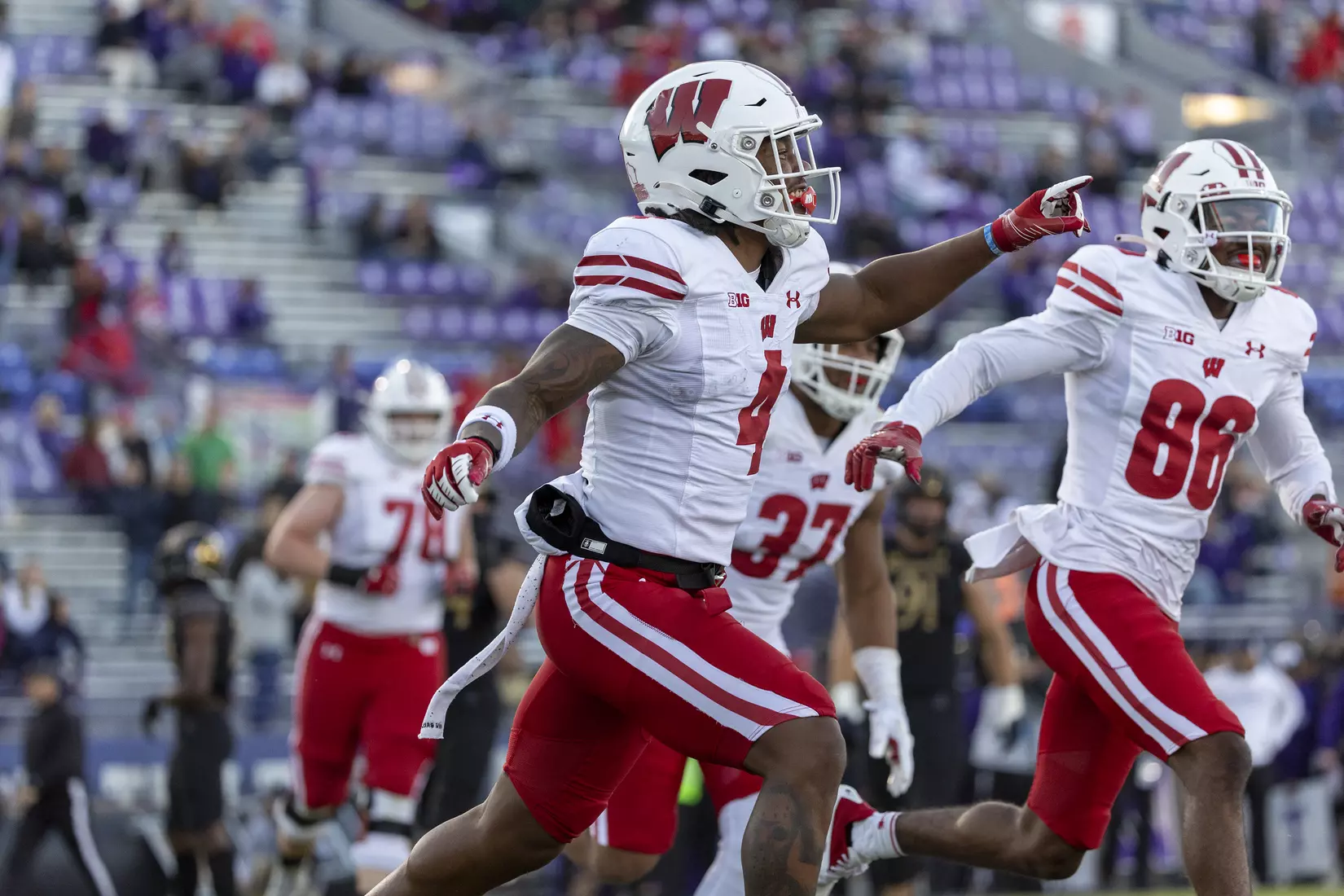 Wisconsin Badgers wide receiver Markus Allen (4) celebrates a touchdown with his teammates during an NCAA Big Ten Conference college football game against the Northwestern Wildcats on Saturday, Oct. 8, 2022, in Evanston, Ill. The Badgers defeated the Wildcats, 42-7.