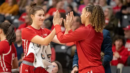 Julie Pospisilova and Savannah White high five