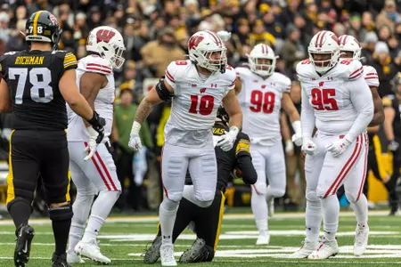 Wisconsin Badgers linebacker Nick Herbig (19) celebrates after sacking Iowa Hawkeyes quarterback Spencer Petras (7) during an NCAA college football game, Sat., Nov. 12, 2022, in Iowa City, Iowa. The Hawkeyes won 24-10. (Photo by David Stluka/Wisconsin Athletic Communications)