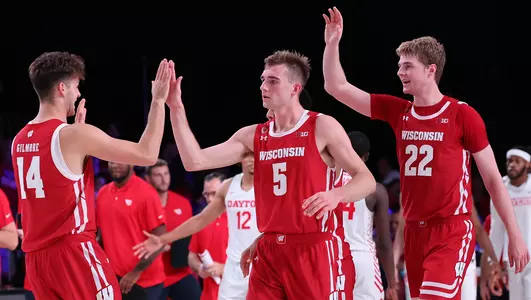 Tyler Wahl and Steven Crowl receive high fives during a game