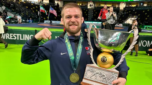 Wisconsin wrestling assistant coach Seth Gross with the 2022 wrestling World Cup trophy. Gross helped Team USA win gold over Mongolia, Georgia and Iran in Coralville, Iowa at Xtream Arena on Saturday, Dec. 10 and Sunday, Dec. 11, 2022.