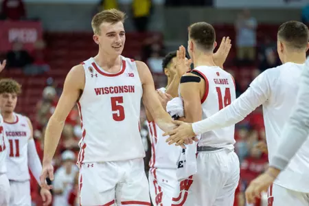 Tyler Wahl celebrates a win over Lehigh at the Kohl Center