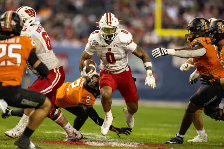 Wisconsin football running back Braelon Allen rushes for 100-plus yards against Oklahoma State in the 2022 Guaranteed Rate Bowl in Phoenix, Arizona on Tuesday, Dec. 27, 2022. The Badgers defeated the Coyboys 24-17.