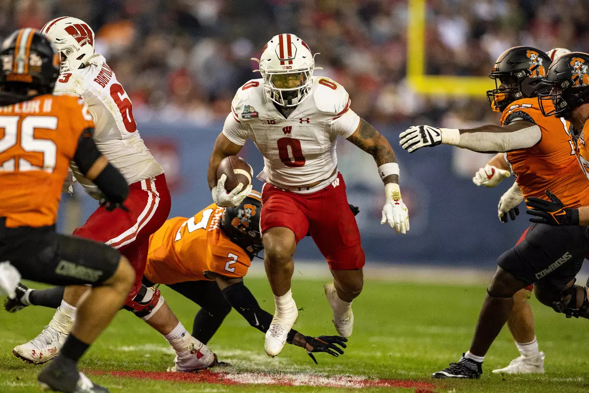 Wisconsin football running back Braelon Allen rushes for 100-plus yards against Oklahoma State in the 2022 Guaranteed Rate Bowl in Phoenix, Arizona on Tuesday, Dec. 27, 2022. The Badgers defeated the Coyboys 24-17.