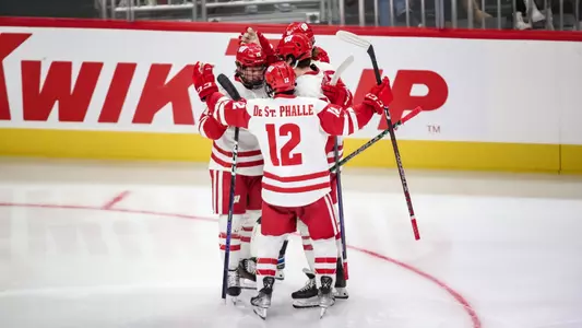 Badgers celebrate goal at Kwik Trip Holiday Face Off