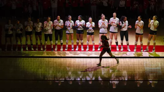 The Badgers line up on the end lines during starting lineup introductions.