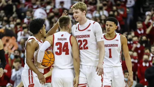 Badgers huddle during a game against Minnesota