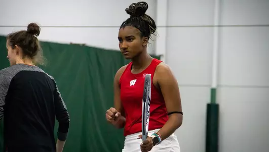 Ariel Johnson celebrates a doubles win