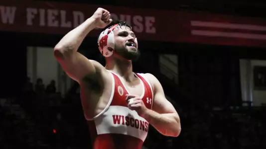 Andrew McNally, Wisconsin wrestling senior, celebrates his victory at 174 pounds against Cornell at the UW Field House in Madison, Wis., on Sunday, Feb. 20, 2022