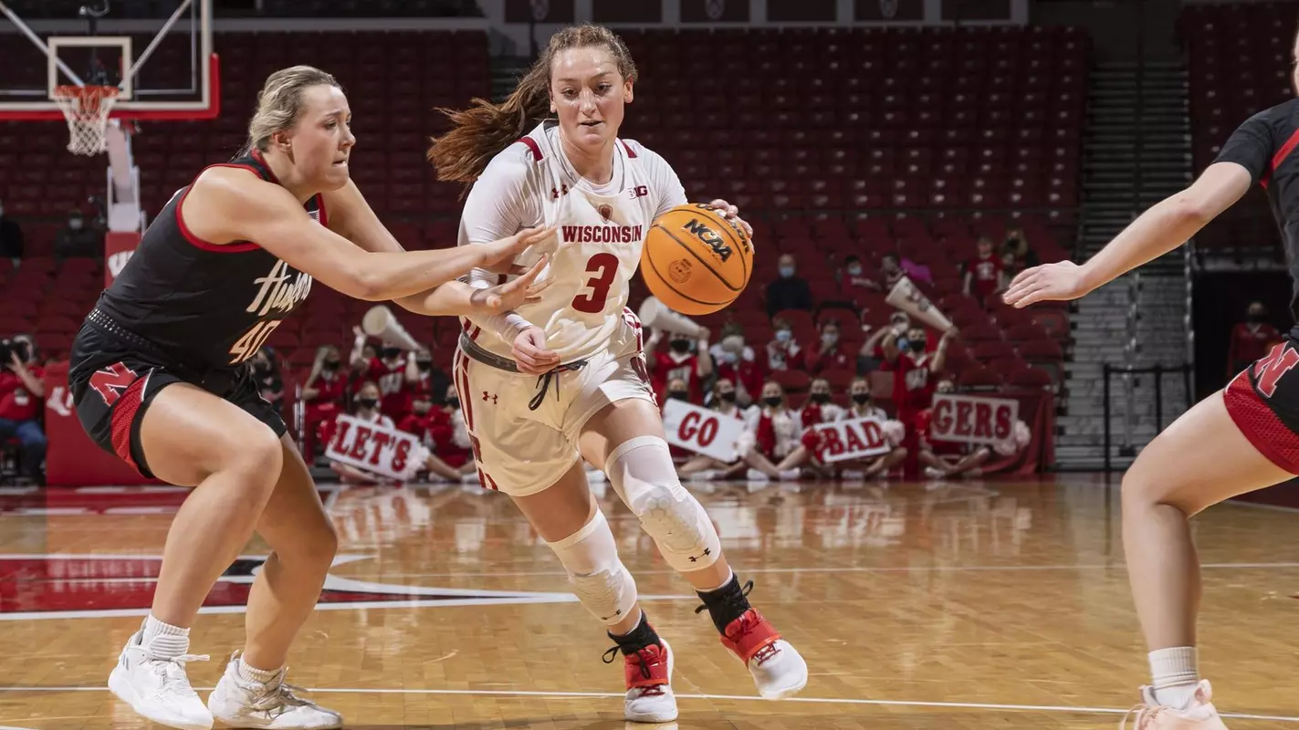 Brooke Schramek drives around a Nebraska defender.