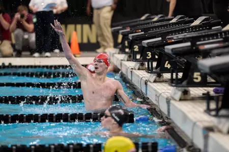 Jake Newmark celebrates