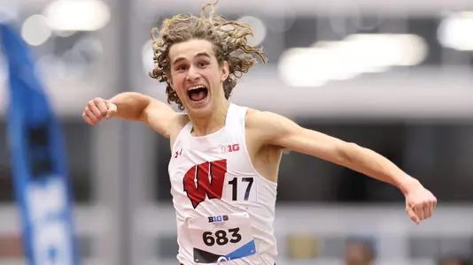 Olin Hacker celebrates his Big Ten win in the 5000 meters