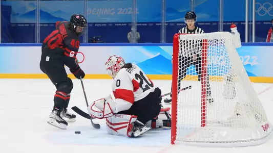 BEIJING, CHINA - FEBRUARY 03: Goalkeeper Andrea Braendli #20 of Team Switzerland makes a save on a shot by Blayre Turnbull #40 of Team Canada during the Women's Ice Hockey Preliminary Round Group A match between Team Canada and Team Switzerland at National Indoor Stadium on February 03, 2022 in Beijing, China. (Photo by Bruce Bennett/Getty Images)