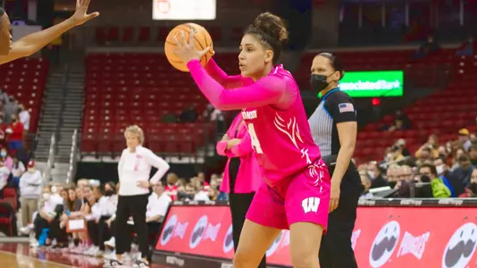 Krystyna Ellew looks to pass the ball.