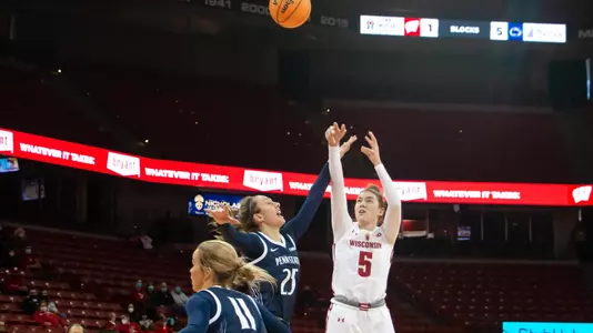 Julie Pospisilova takes a shot over a Penn State defender.