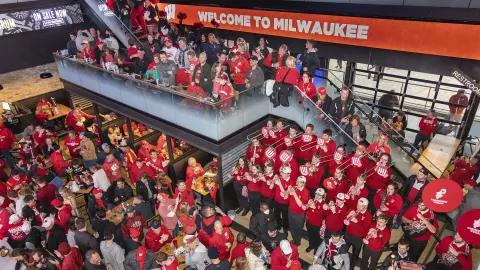 Fans and UW Band at pregame pep rally at The MECCA in Deer District  outside Fiserv Forum in Milwaukee - 2022 NCAA Tournament