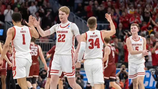 Badgers celebrate during a game against Colgate