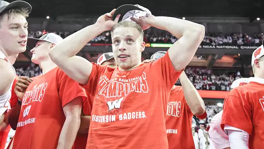 Carter Higginbottom celebrates winning a Big Ten championship