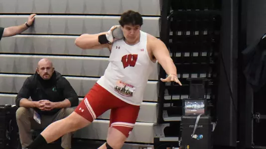 Jason Swarens competes in shot put