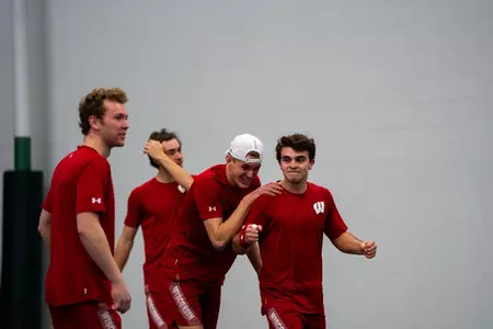 Sebastian Vile celebrates with his teammates after clinching the match vs. Drake Feb. 6