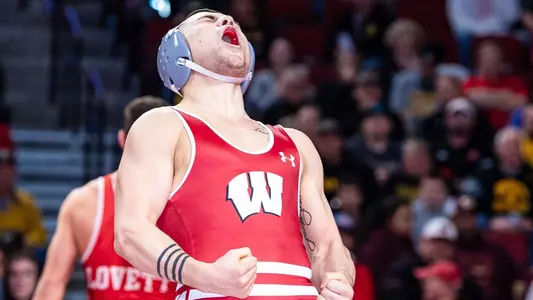 Austin Gomez, Wisconsin wrestling, celebrates a 20-second pin of Nebraska's Ridge Lovett in the semifinal of the 2022 Big Ten Championships at 149 pounds. Gomez won the Big Ten title on Sunday, March 6, 2022 in Lincoln, Nebraska.