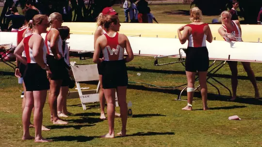 Rowing athlete with taped W on back