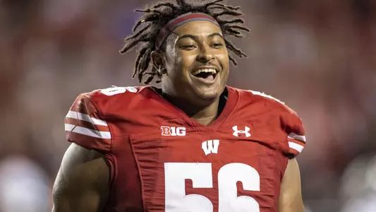 DE Rodas Johnson (56) smiles during the Badgers' game vs. Eastern Michigan on Sept. 11, 2021