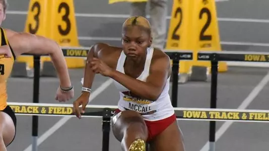 Kaylah McCall competes in hurdles