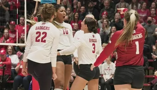 The Badgers celebrate a point on the court.
