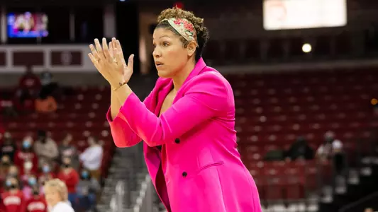 Head coach Marisa Moseley cheers on her team from the sideline.