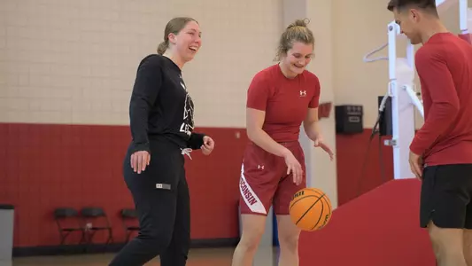 Kate Barnosky chats with Maty Wilke during practice.