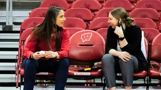 Caroline Doty and Kate Barnosky chat before a game.