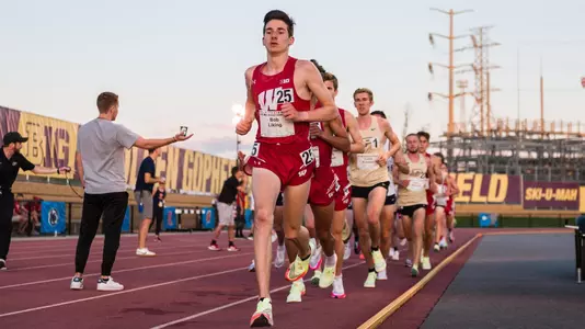 Bob Liking leads the race in the 10,000 meters at the Big Ten Championships.