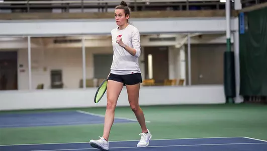 Ava Markham celebrates during a dual match