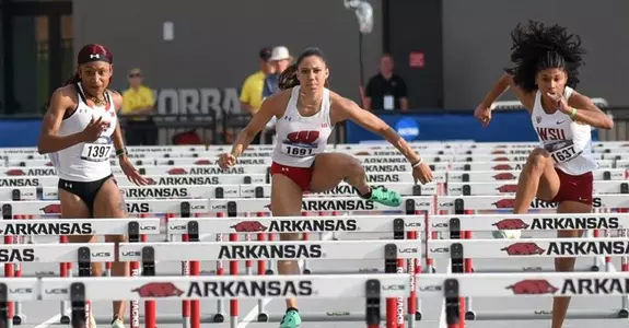 Destiny Huven runs the 100-meter hurdles