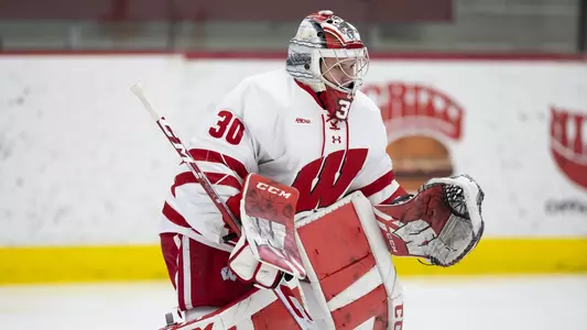 Wisconsin Badgers goaltender Cami Kronish (30) defends during warmups prior to an NCAA women’s college ice hockey game against the Minnesota State Mavericks, Saturday, Feb. 12, 2022, in Madison, Wis.(Photo by David Stluka/Wisconsin Athletic Communications)