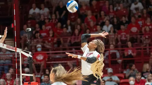 Jade Demos attacks the ball on the right side.