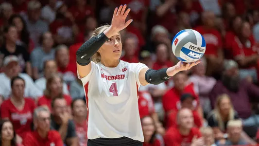 Liz Gregorski holds the ball as she gets ready to serve