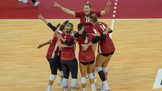 The Badgers celebrate a point on the court.