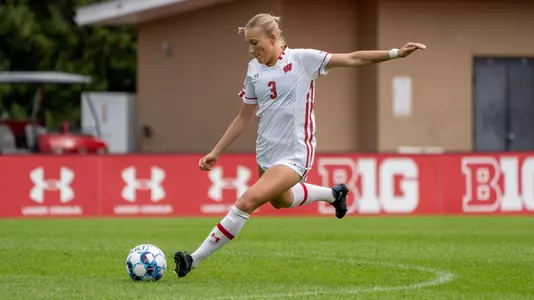 Aidan McConnell kicking ball with arm in air perfect form