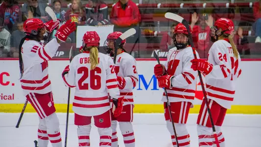 Wisconsin Badgers women's hockey celebrates a goal in their 10-0 win against Lindenwood on Sept. 30