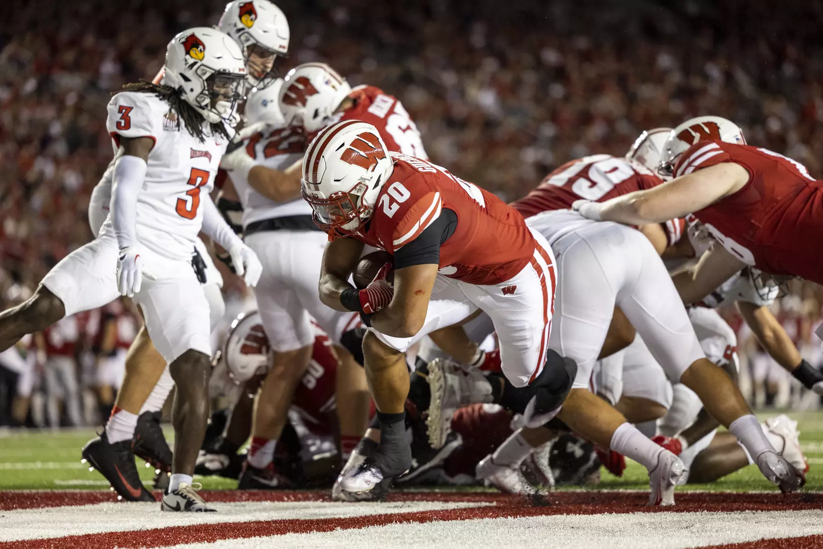Wisconsin Badgers running back Isaac Guerendo (20) rushes one yard to score the Badgers’ fifth touchdown of the night during an NCAA college football game against the Illinois State Redbirds at Camp Randall Stadium on Saturday, Sept. 3, 2022 in Madison, Wis.