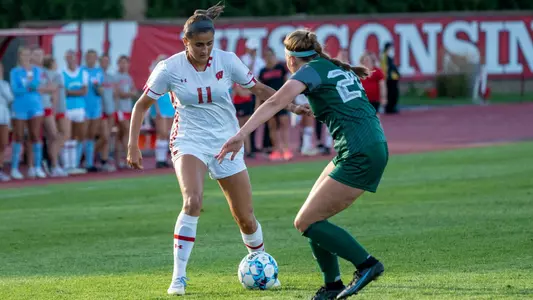 Riley Philbin dribbling with a defender nearby