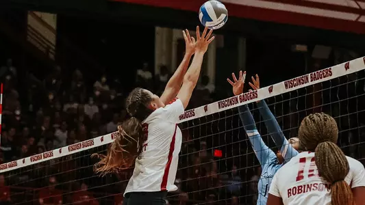 Danielle Hart goes up for a block solo against a Marquette attacker.