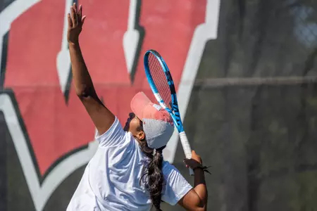 Wisconsin's Anisha Apte serves the ball