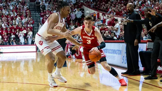 Connor Essegian dribbles the basketball during a game at Indiana