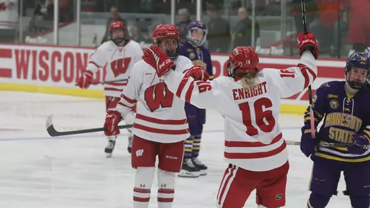 Lacey Eden and Claire Enright celebrate a goal against Minnesota State on Saturday, Jan. 21