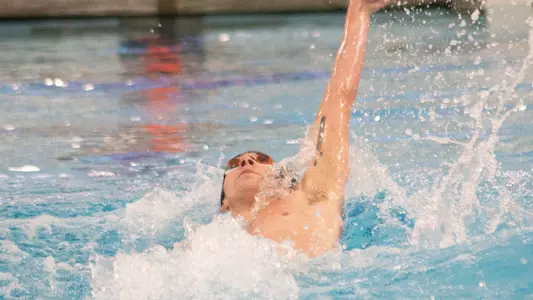 Jake Newmark competes in the backstroke