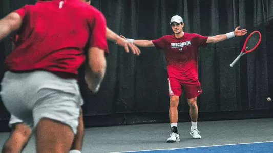 Mihailo Popovic celebrates his singles win over Princeton