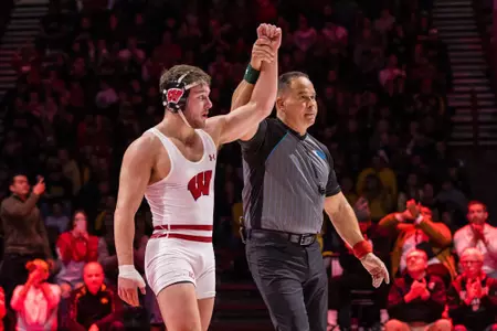 Josh Otto, Wisconsin wrestling, has his arm raised as the winner during Wisconsin's dual against No. 2 Iowa on Sunday, January 27, 2023 at the UW Field House.